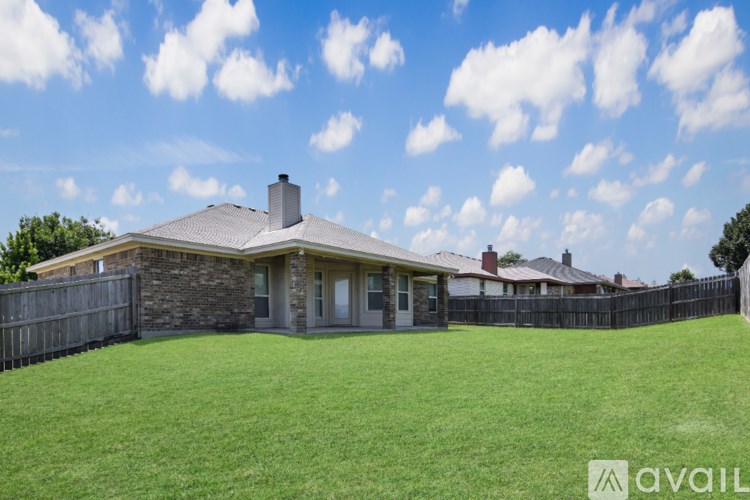 A house with a stone facade and a white door is for sale.