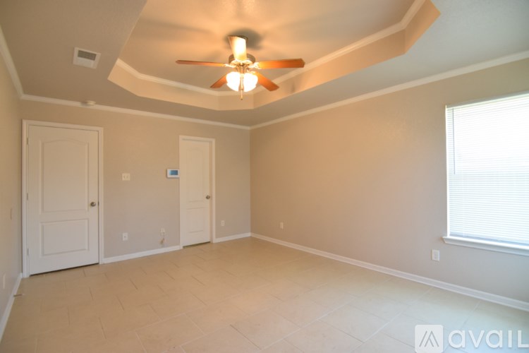 A wooden fence runs along the back of a yard.
