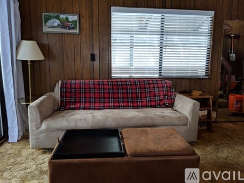 A living room with a couch and a coffee table.