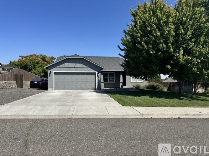 A two-car garage with a brown door is available for rent.