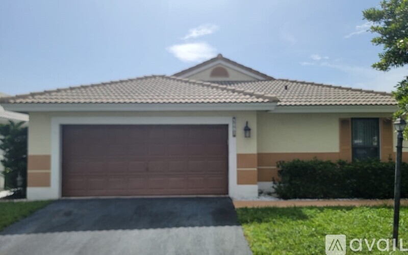 A house with a brown garage door is for sale.