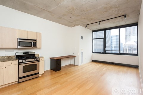 A kitchen with a stove top oven and microwave.
