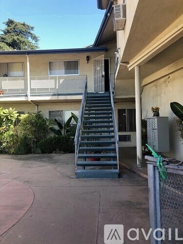A house with a staircase leading to the second floor.