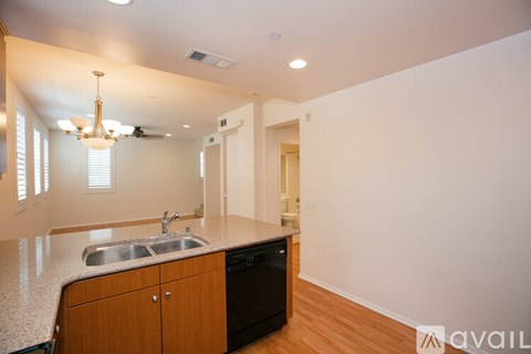A kitchen with a sink and cabinets.