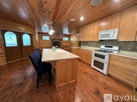 A kitchen with wooden cabinets and a white countertop.