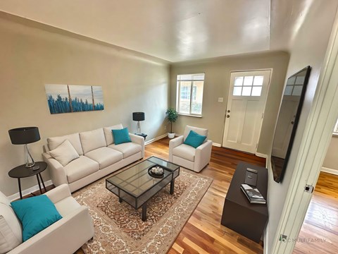 A room with wooden walls and a white door.