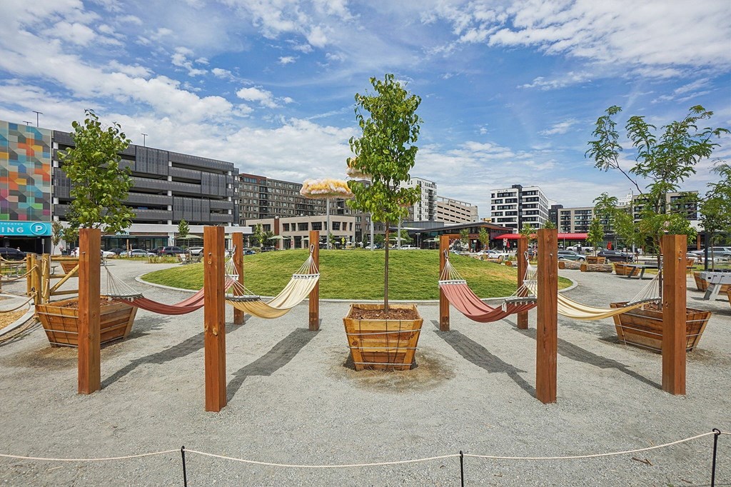 A playground with a swing set and a slide.