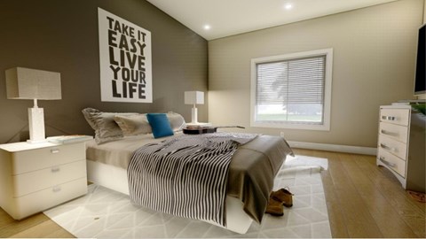 A bedroom with a bed, nightstands, and a motivational poster on the wall.