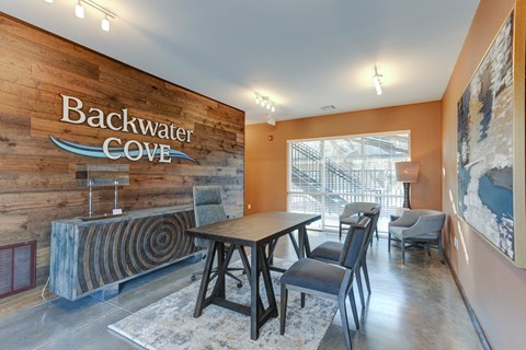A dining area with a wooden table and chairs.