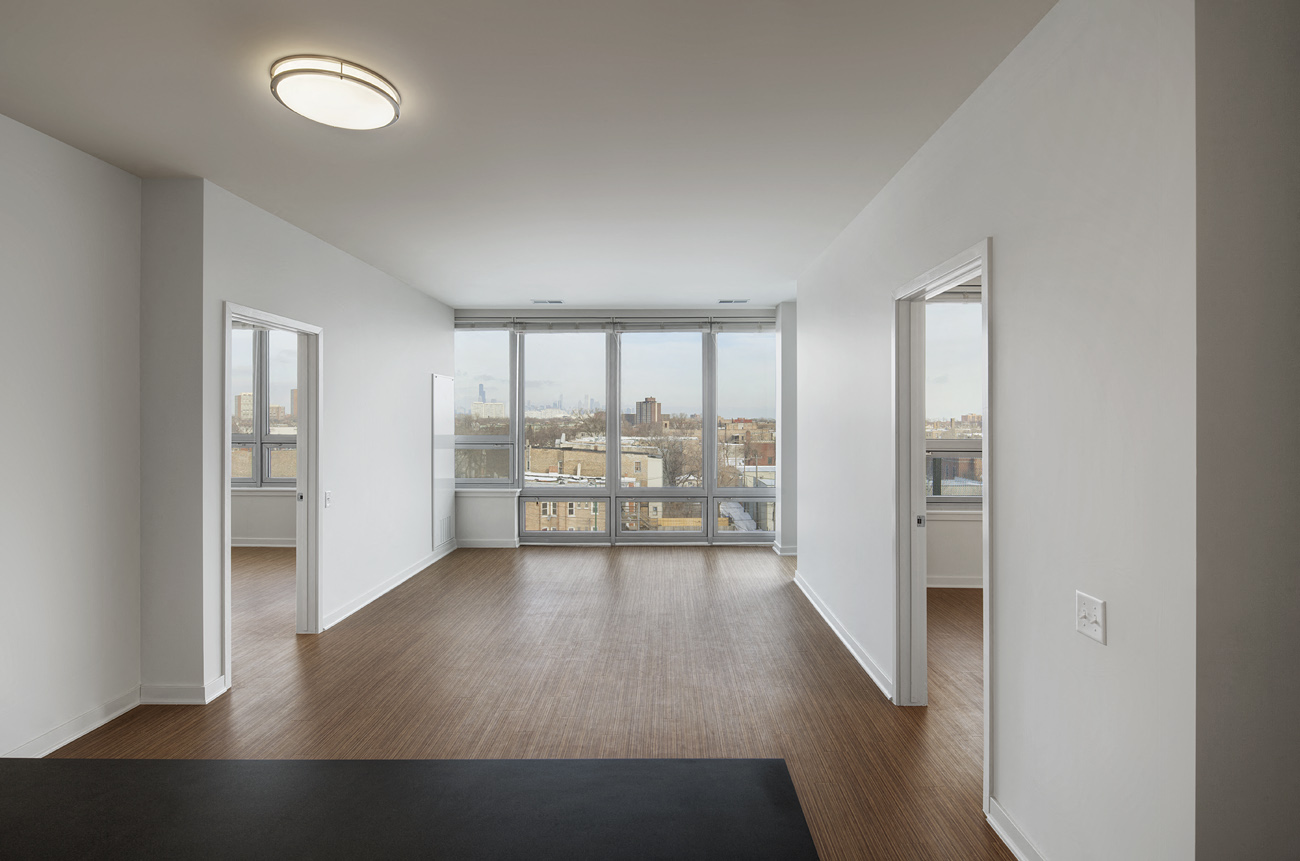 a living room with a view of a city and a window