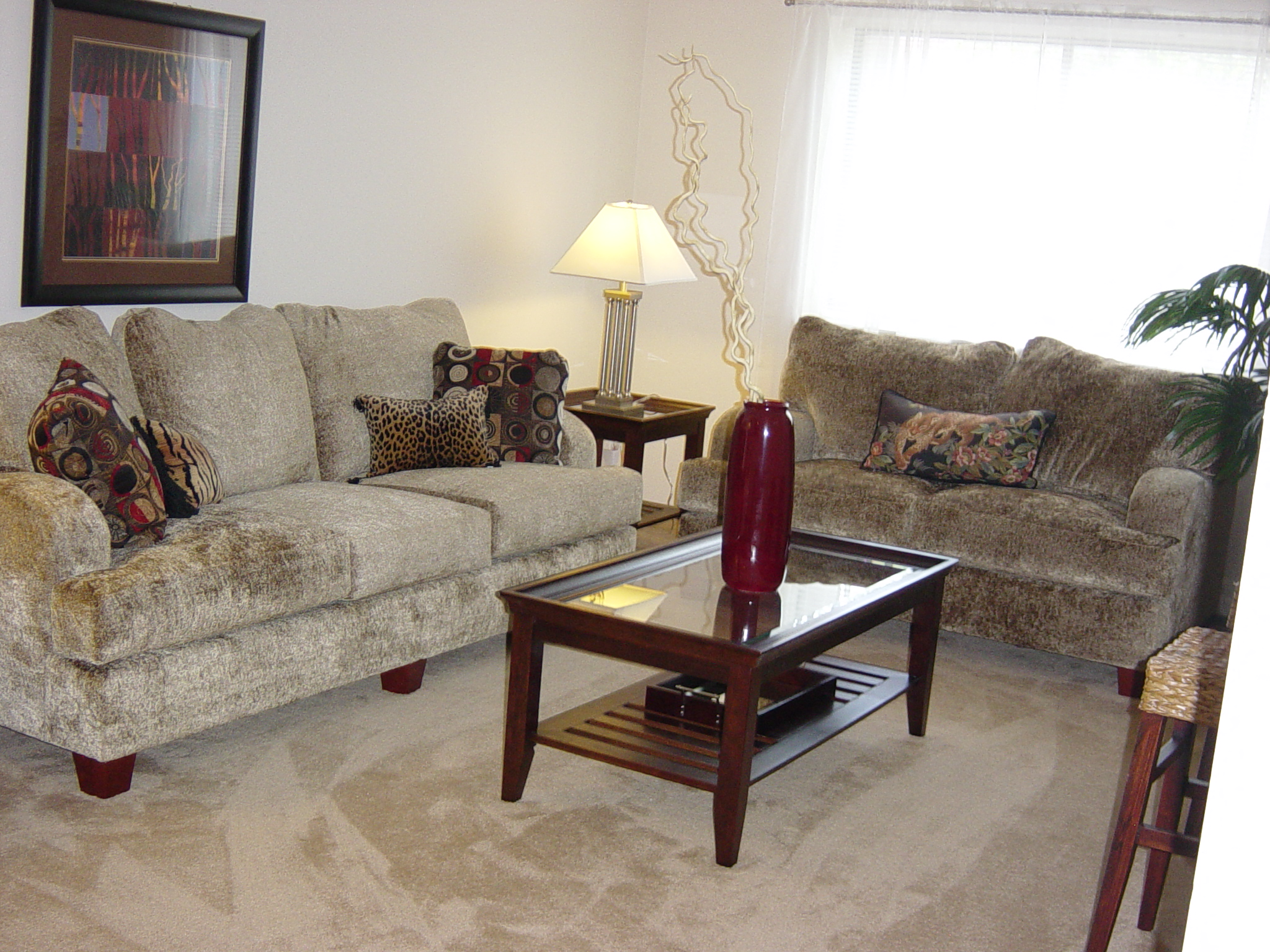 a living room with couches and a coffee table