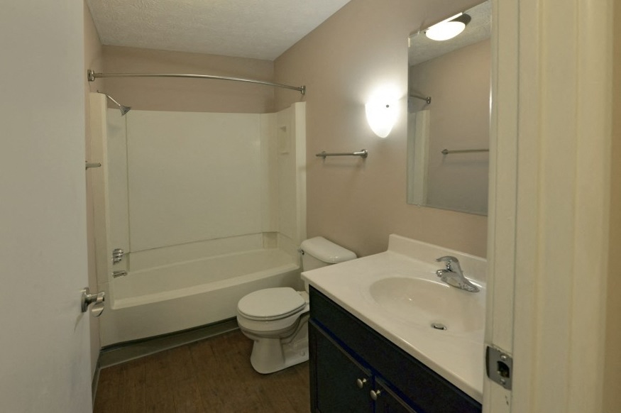a bathroom with a sink toilet and a shower
