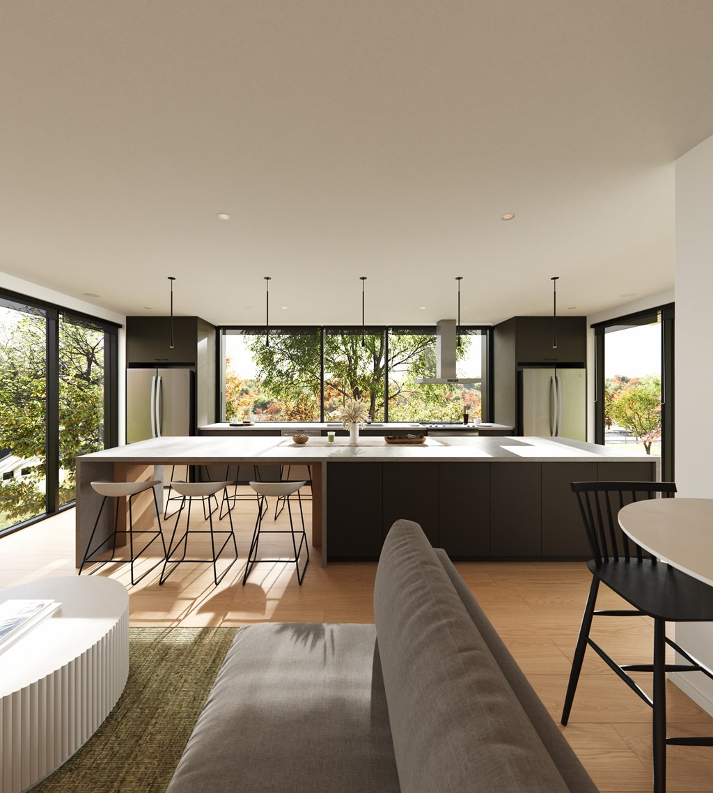A modern kitchen with a dining table and chairs.