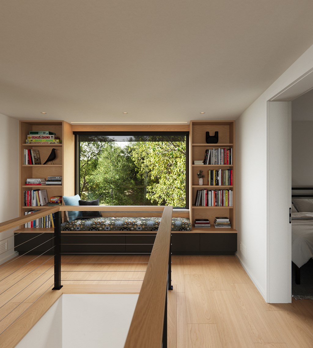 A room with a large window and a wooden floor.