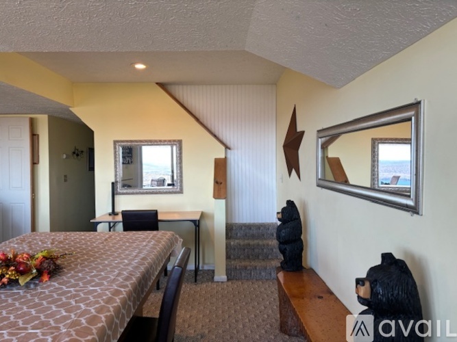 A bedroom with a bed, desk, and chair.