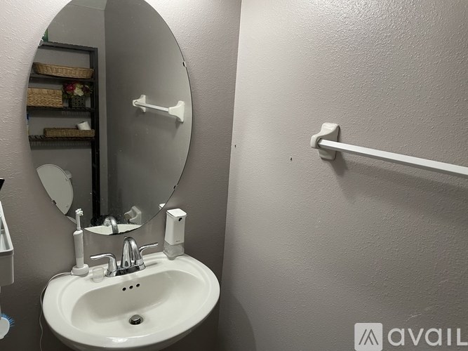 A bathroom sink with a mirror above it.
