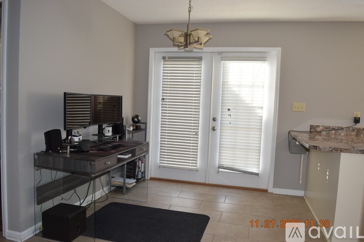 A room with a table, a chair, and a cabinet.