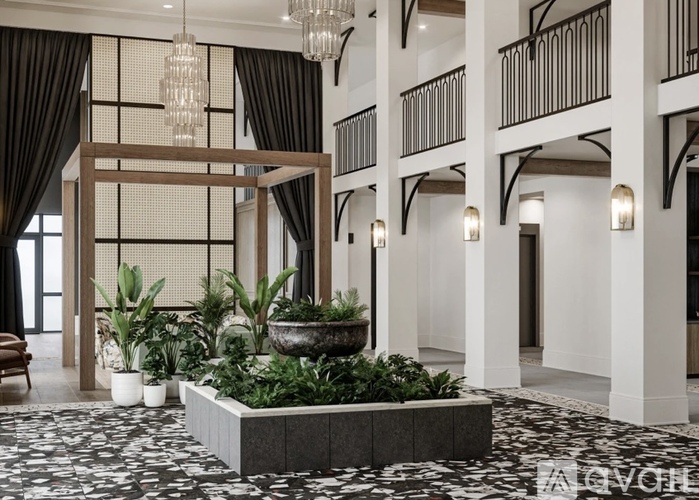 A large indoor space with a planter in the middle.