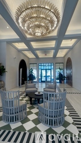 A large indoor space with a planter in the middle.