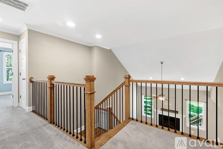 A living room with a staircase leading to the upper floor.
