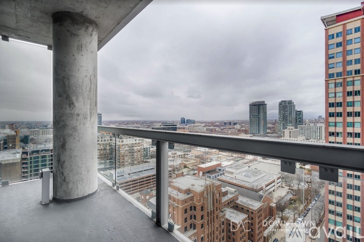 A view from a high-rise building looking out over a cityscape.