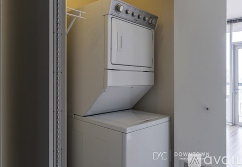 A white oven and dishwasher are installed in a kitchen.