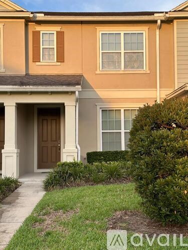 A house with a brown door and a brown window.
