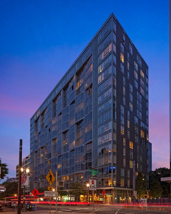a tall building with a street in front of it