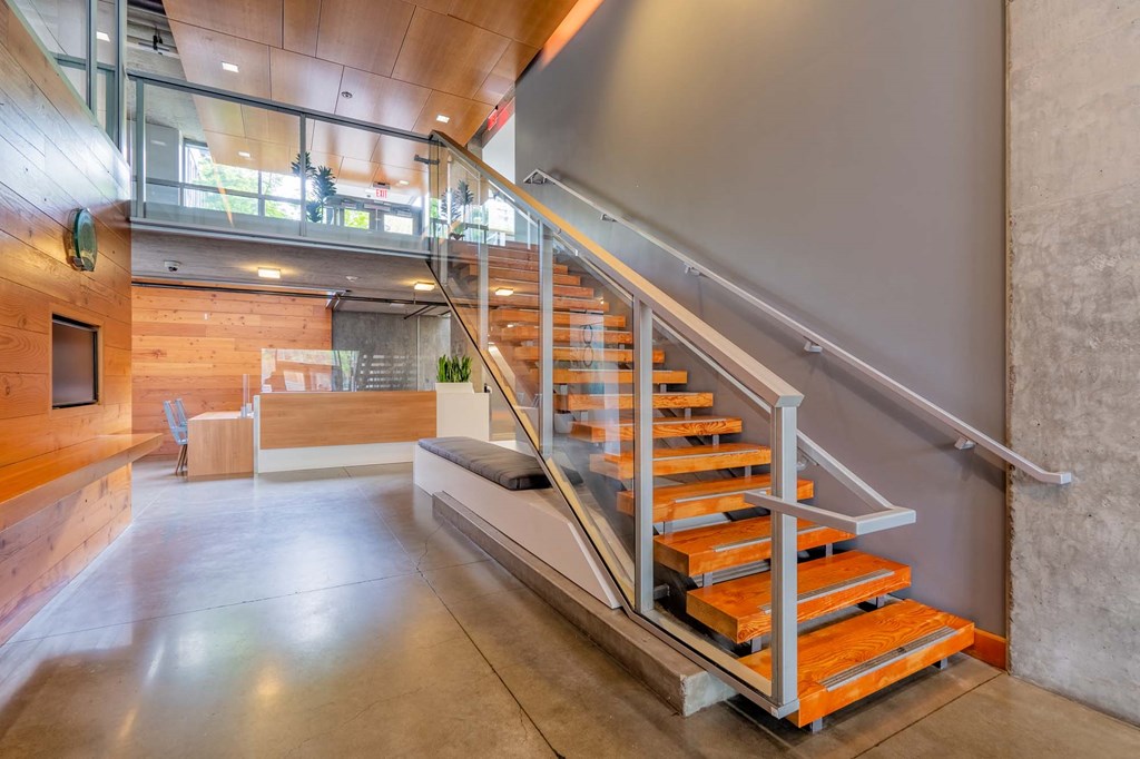 a staircase with orange steps in a lobby