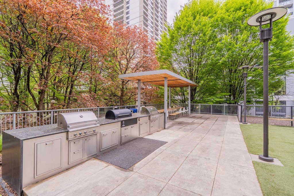 the cookout area has a grill and a picnic table