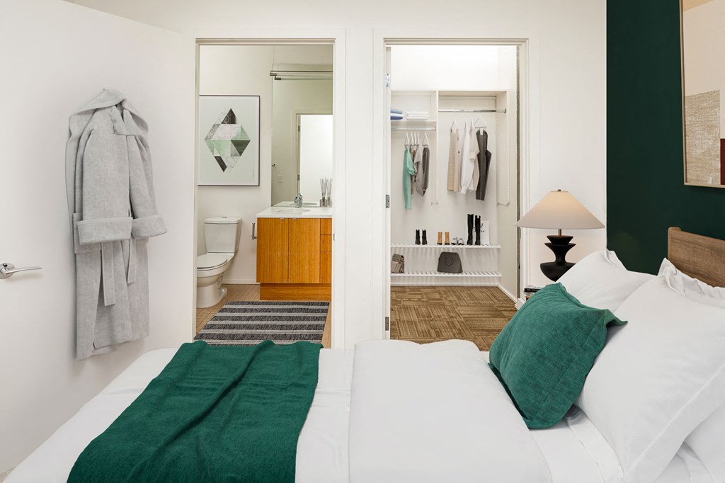 a bedroom with a bed and a bathroom