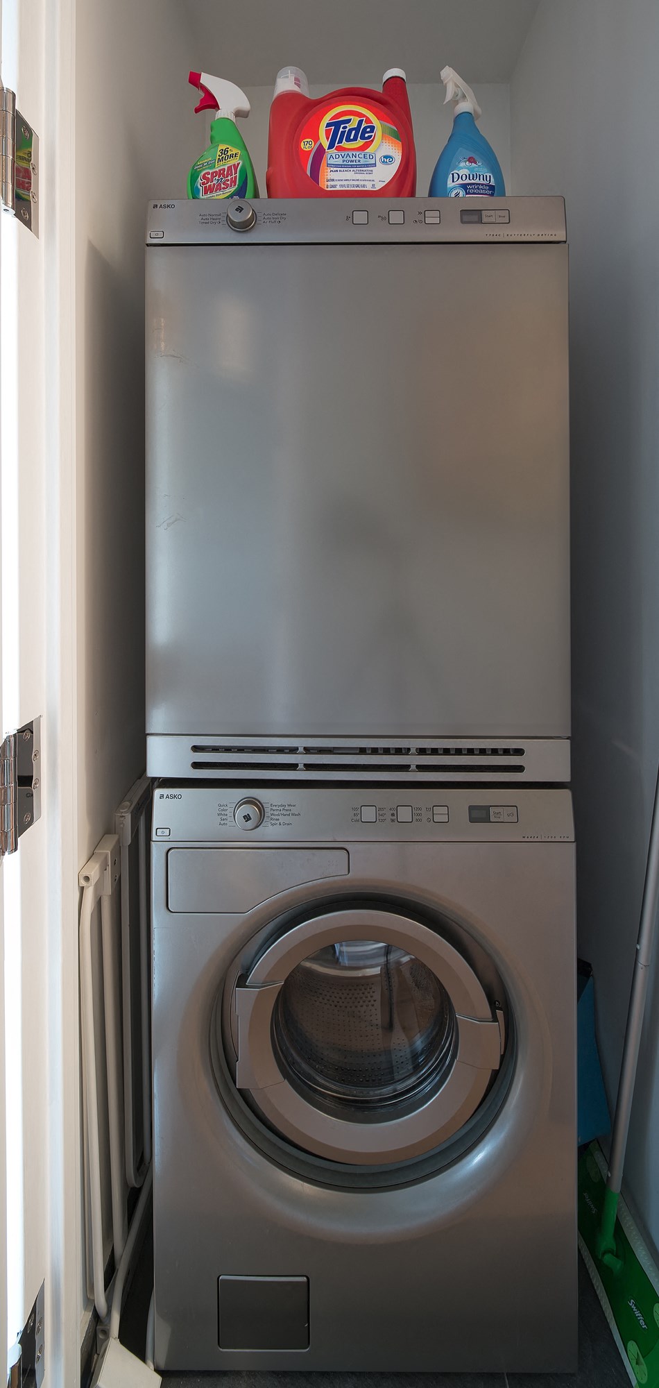 a washer and dryer in a small laundry room