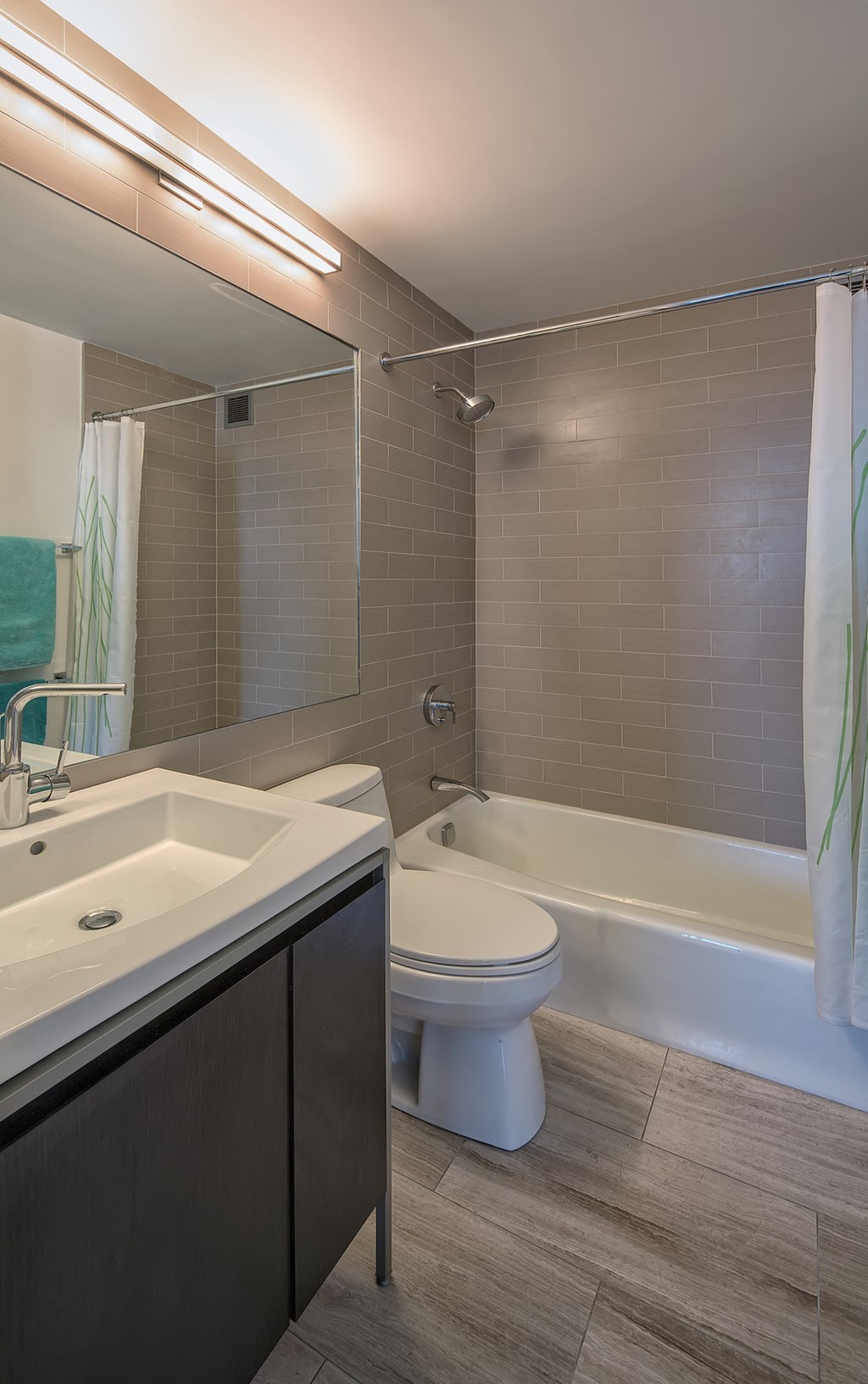 a bathroom with a sink toilet and a bath tub
