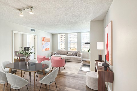 A living room with a grey table and chairs.