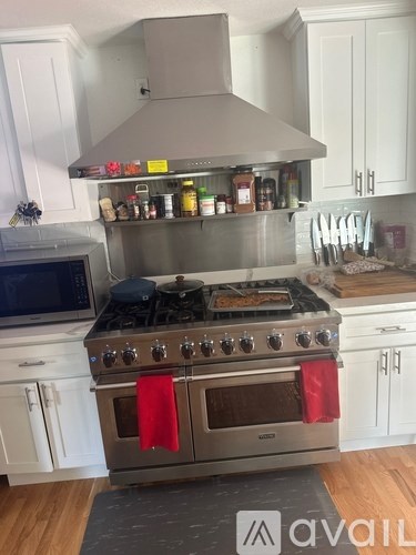 A kitchen with a stove top oven and a microwave.