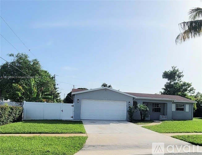 A house with a white garage door is for sale.