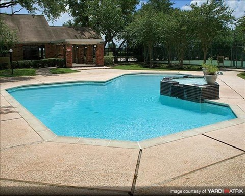 a swimming pool in a backyard with a house