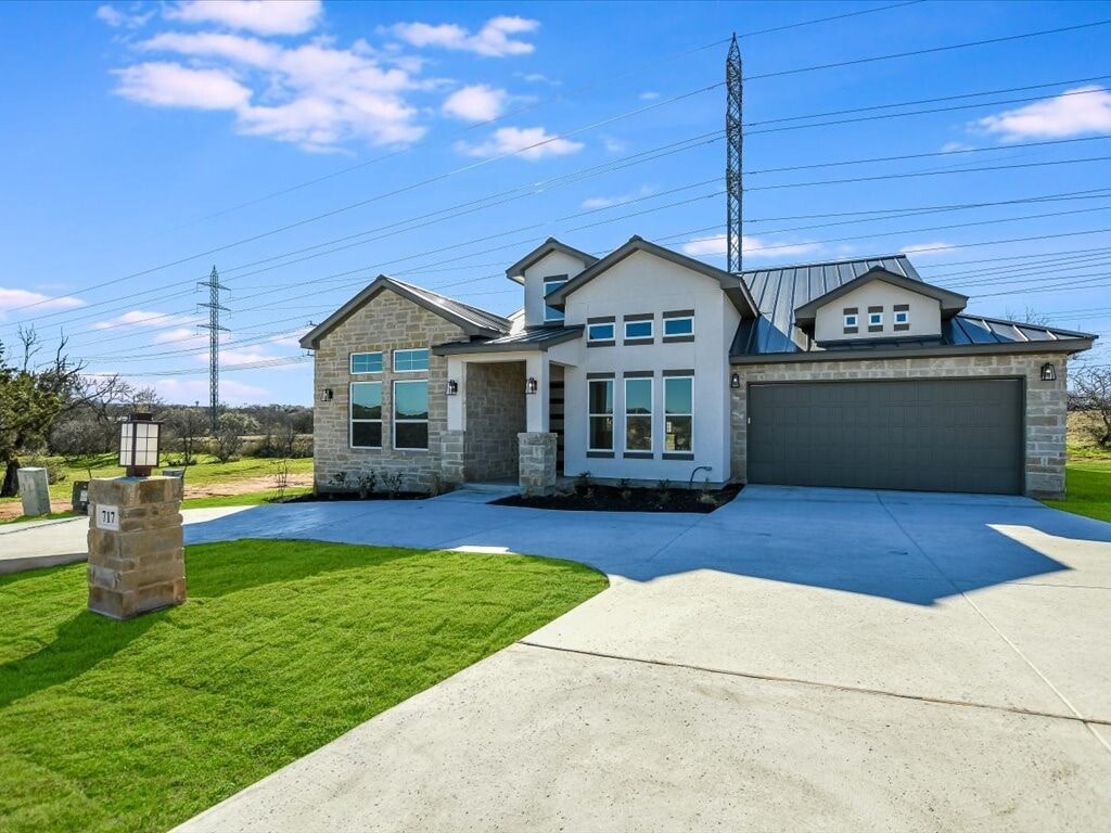 A large house with a garage and a driveway.