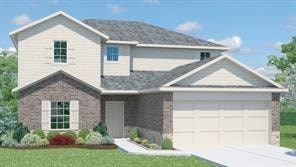 A two-story house with a garage and a brick facade.