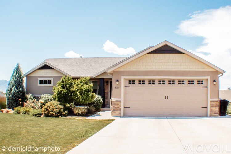 A two-car garage is attached to a house.
