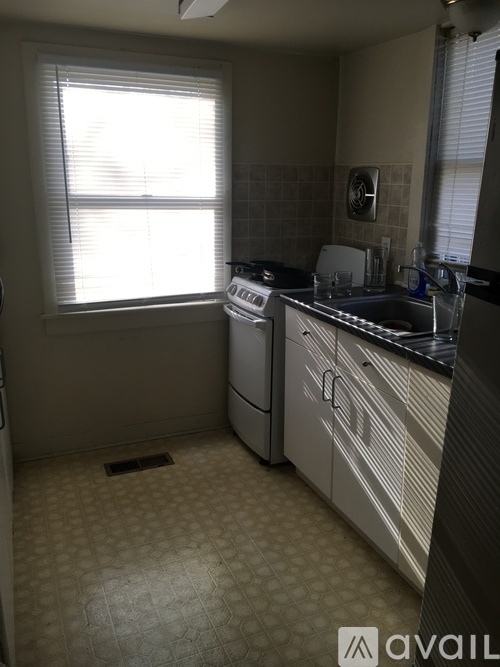 A kitchen with a washer and dryer in it.