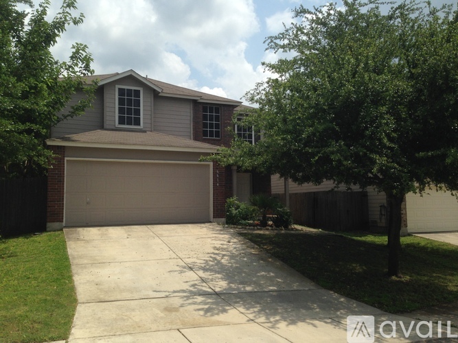 A house with a garage and a driveway.