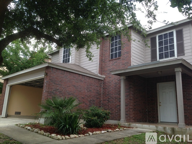 A house with a garage and a driveway.