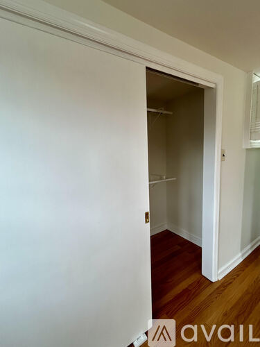 A kitchen with wooden cabinets and a white refrigerator.