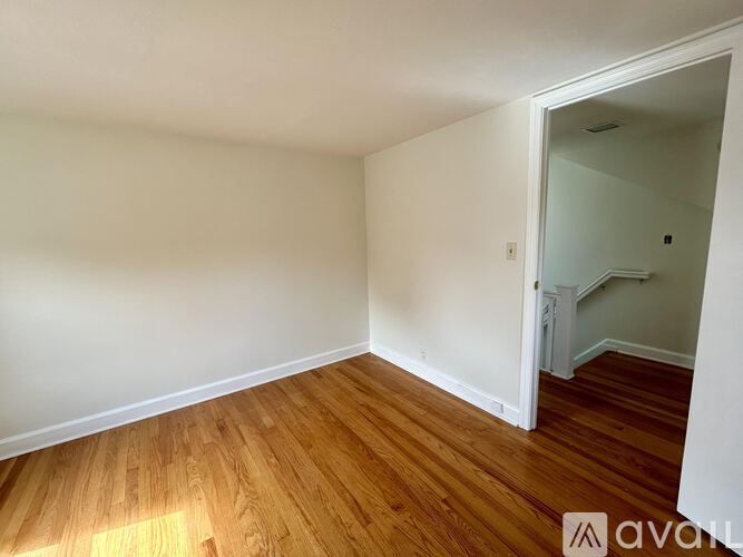 A room with a ceiling fan and skylights.