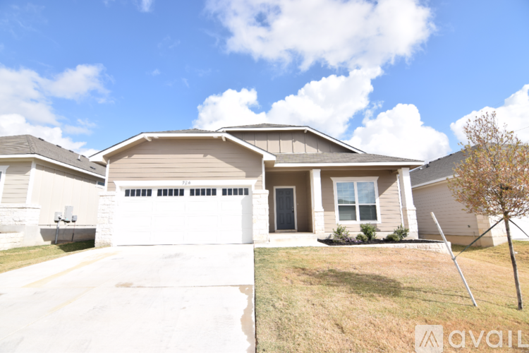 A house with a garage is available for sale.
