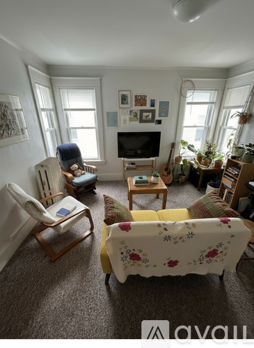 A kitchen with a stove top oven and a dining table.