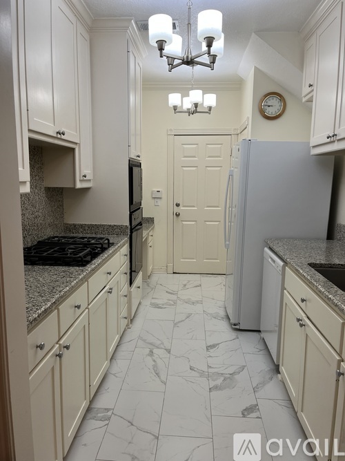 A white garage door is on the right side of the image.