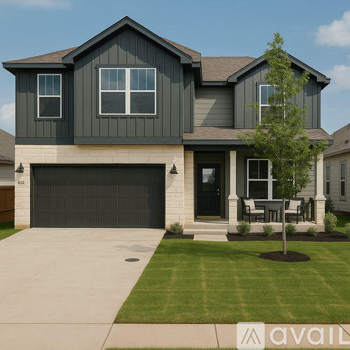 A house with a grey exterior and a black garage door.