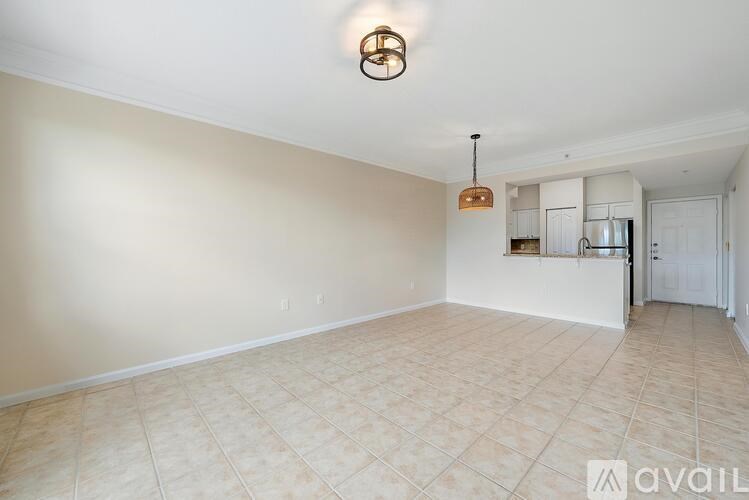 A room with beige walls and a tiled floor.